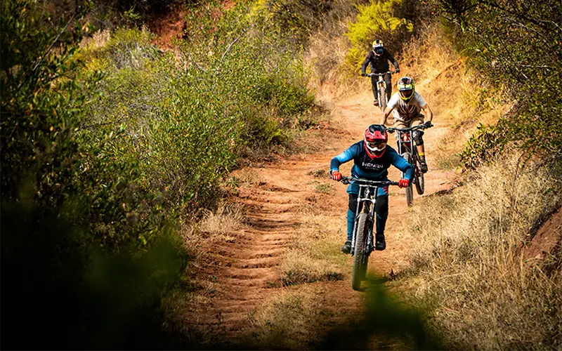 Two riders descending rocky section on Lamay route (Peru Biking Tours)